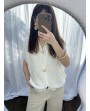 Pull sans manches blanc à boutons coeurs